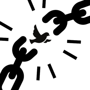 A dove flies out of broken chains.